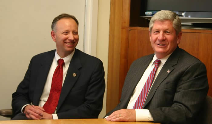 Saratoga County District Attorney Jim Murphy, left, and State Senator Roy MacDonald (R-Stillwater) discuss child abuse issues at the Center for the Family  in Saratoga Springs, New York