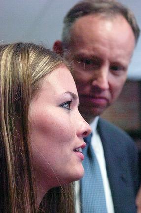 District Attorney James Murphy looks on while the Victim in the Hernandez Lopez case speaks out